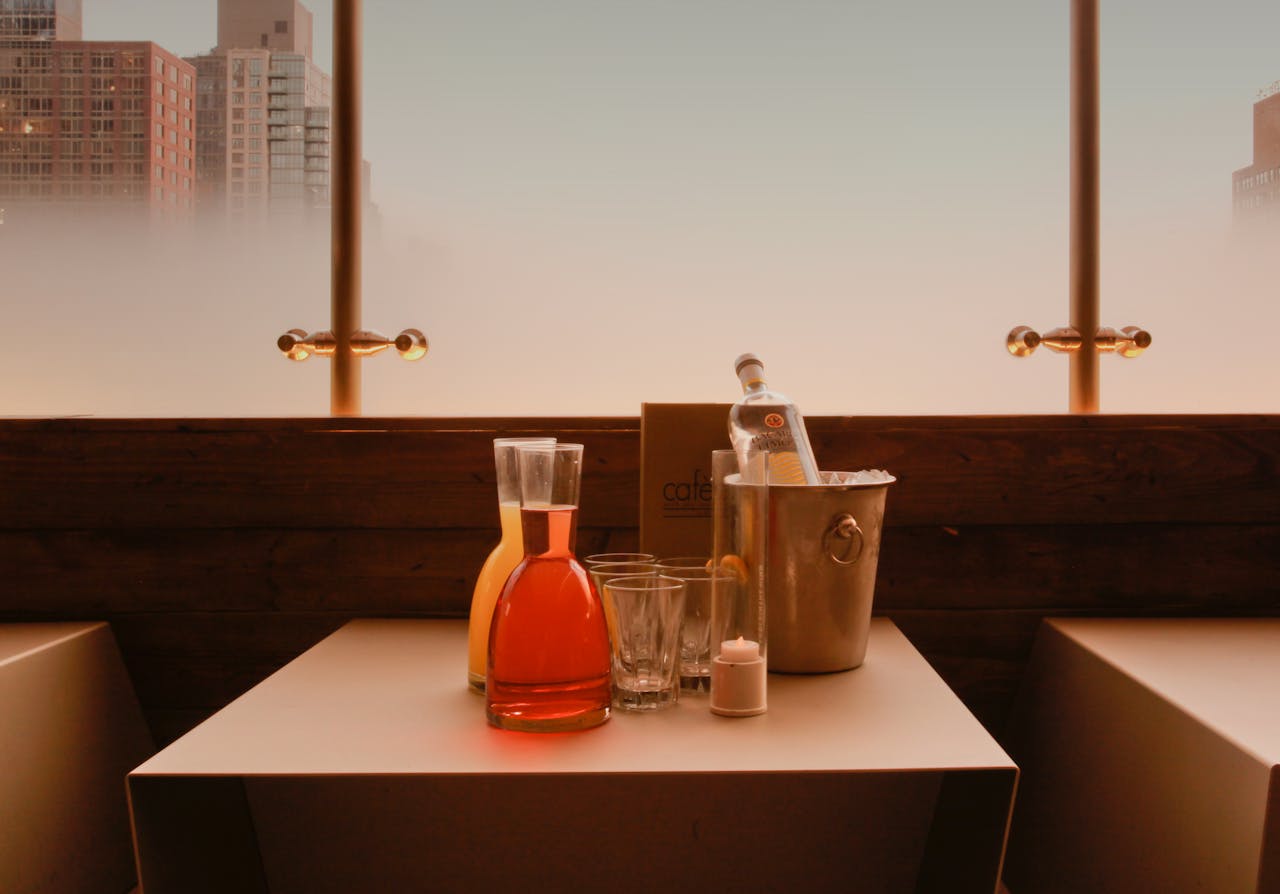 Stylish modern restaurant table with drinks in a city setting.
